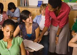 Teacher helping student 